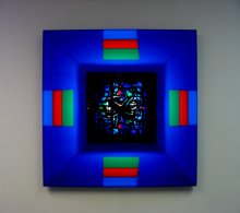 Mel Tanner wall sculpture with blue background and abstract painting in the center