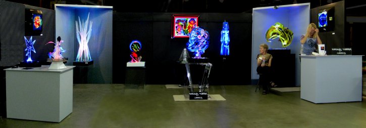 Lumonics art installation at Denver Modernism Show. Dorothy Tanner, seated and Barbara Billard, standing
