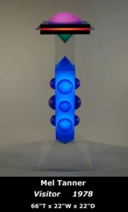 Free-standing sculpture with bubble on top and two pyramids facing each other