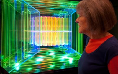 Dorothy Tanner looking at her light sculpture