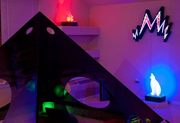 installation with a Lumonics plexiglass pyramid and several light sculptures in a residence