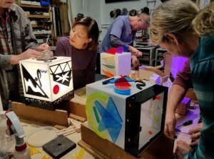 students making cubes at Lumonics School of Light Art