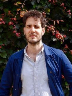 Man in front of flowering tree