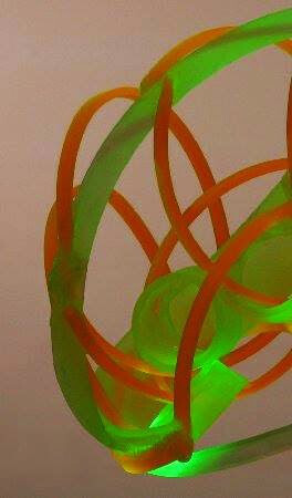 detail of light sculpture with green and amber colors